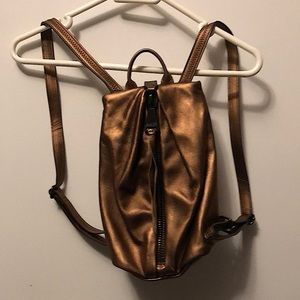 Compact Metallic Backpack Purse